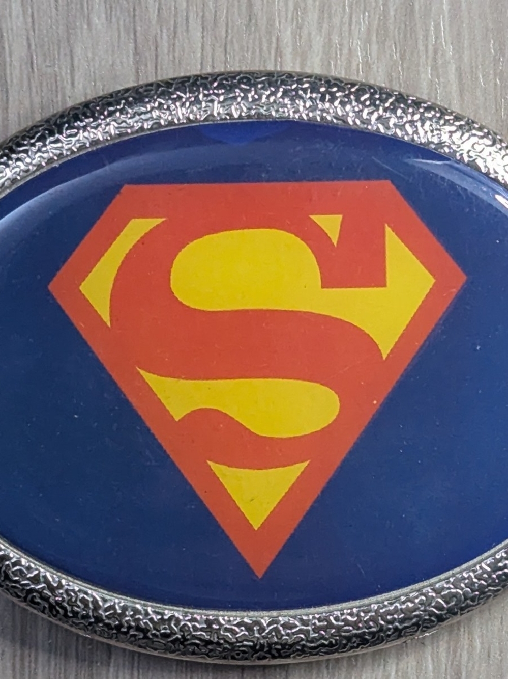 DC Oval Shield Belt Buckle — Red, Yellow & Blue